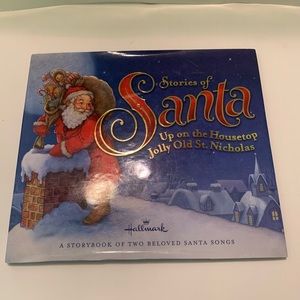 Hallmark book. Santa up on the rooftop.